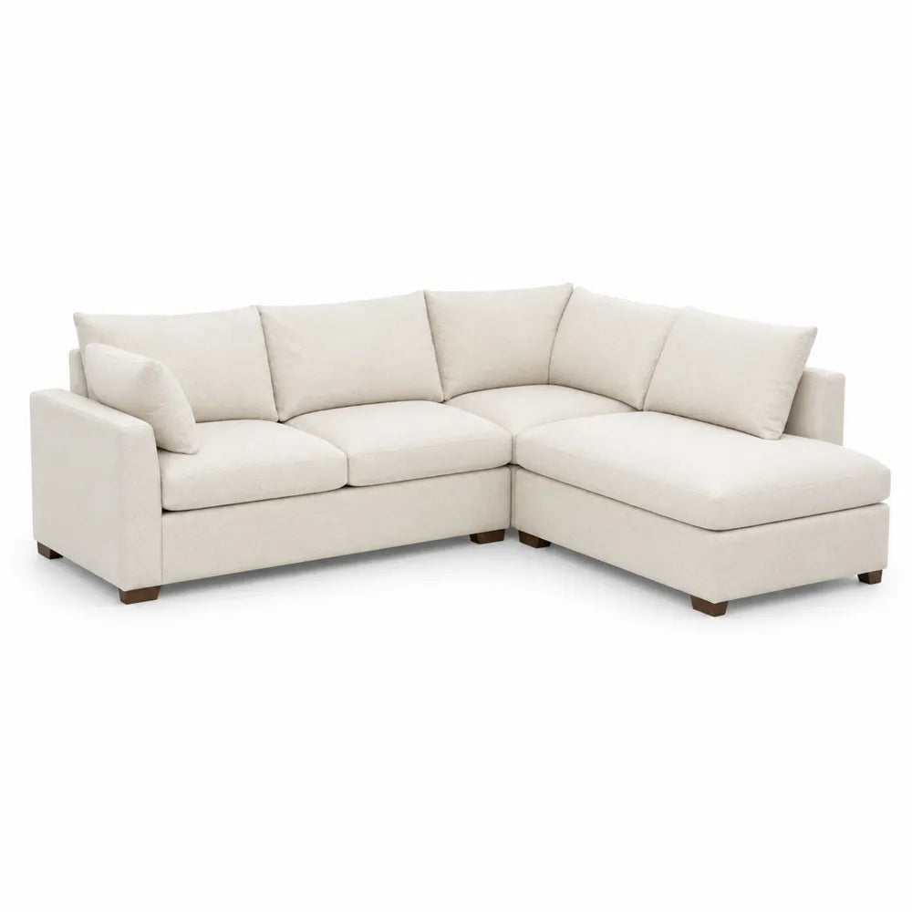 Narożna sofa z kremowej tkaniny z modułami