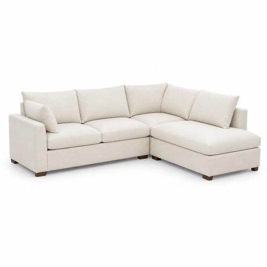 Narożna sofa z kremowej tkaniny z modułami